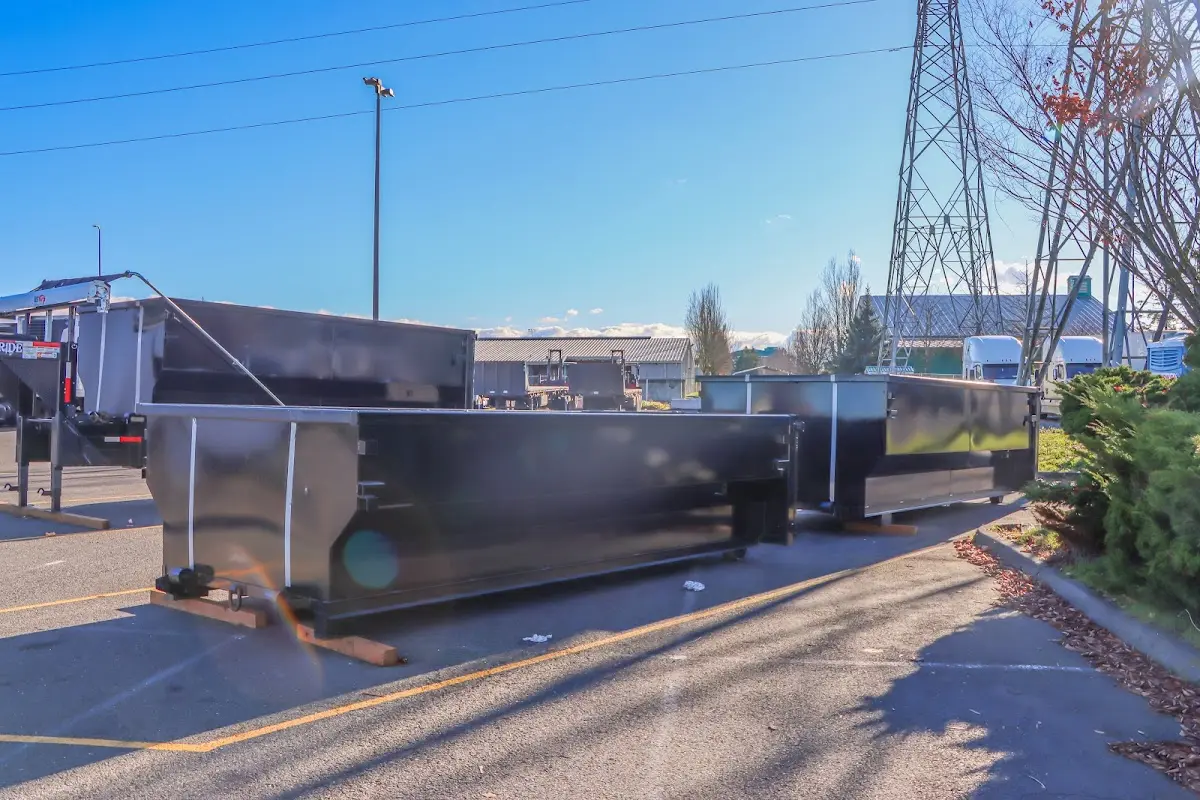 Roll-off dumpster ready for waste disposal at job site for Concrete Dumpster Rental in Granbury